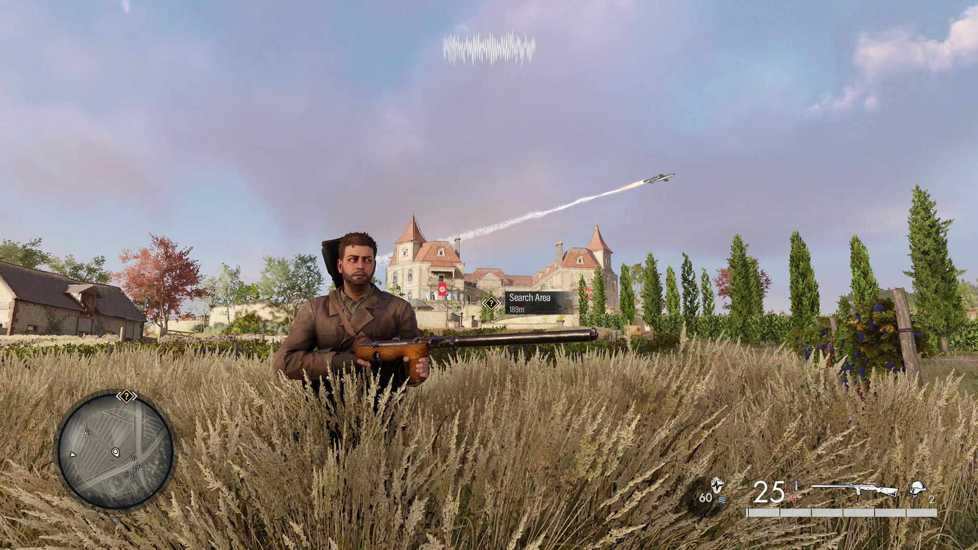 The image shows the player standing in a field. A large chateau can be seen in the distance.