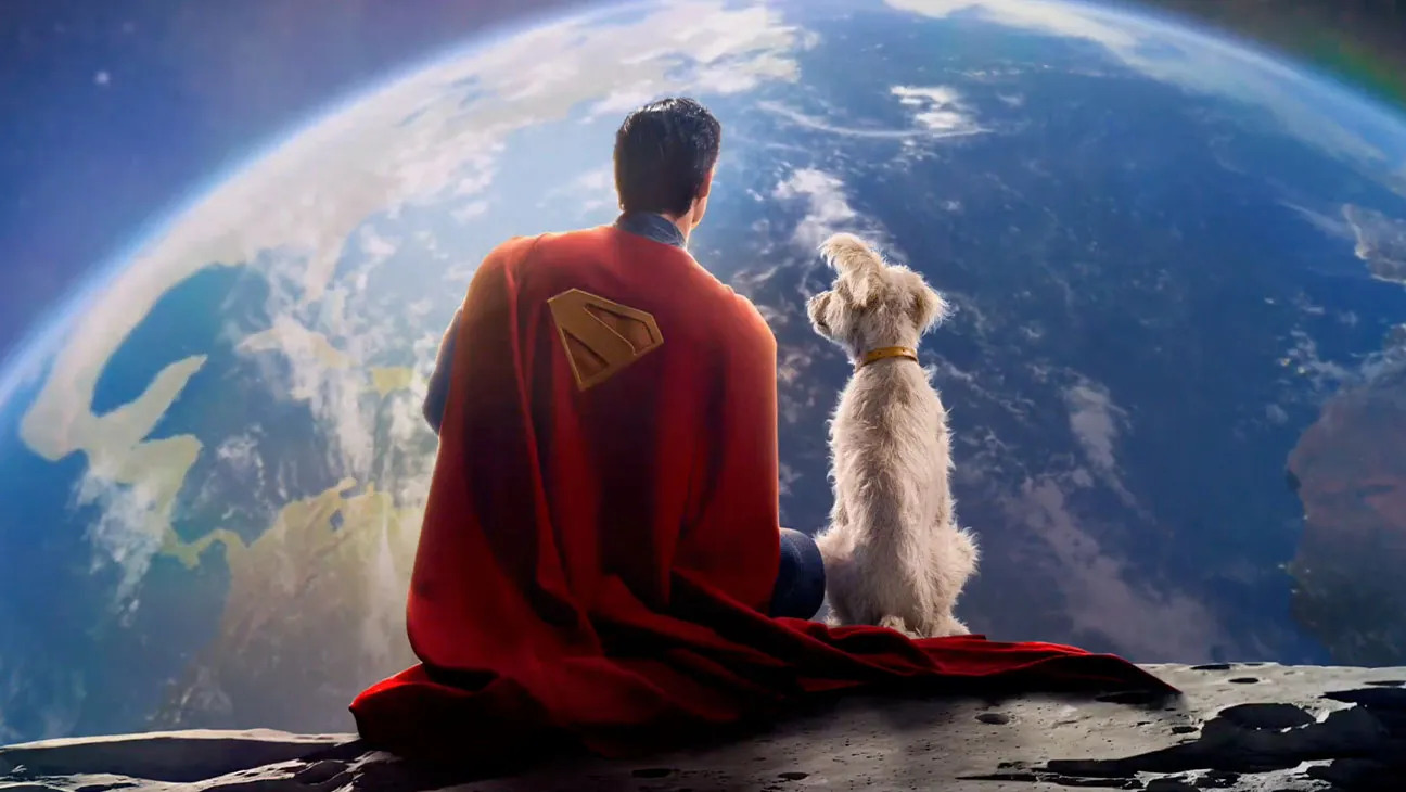 Superman (David Corenswet) sitting on a meteorite beside his dog Krypto overlooking the Earth in a promo poster for James Gunn’s Superman.