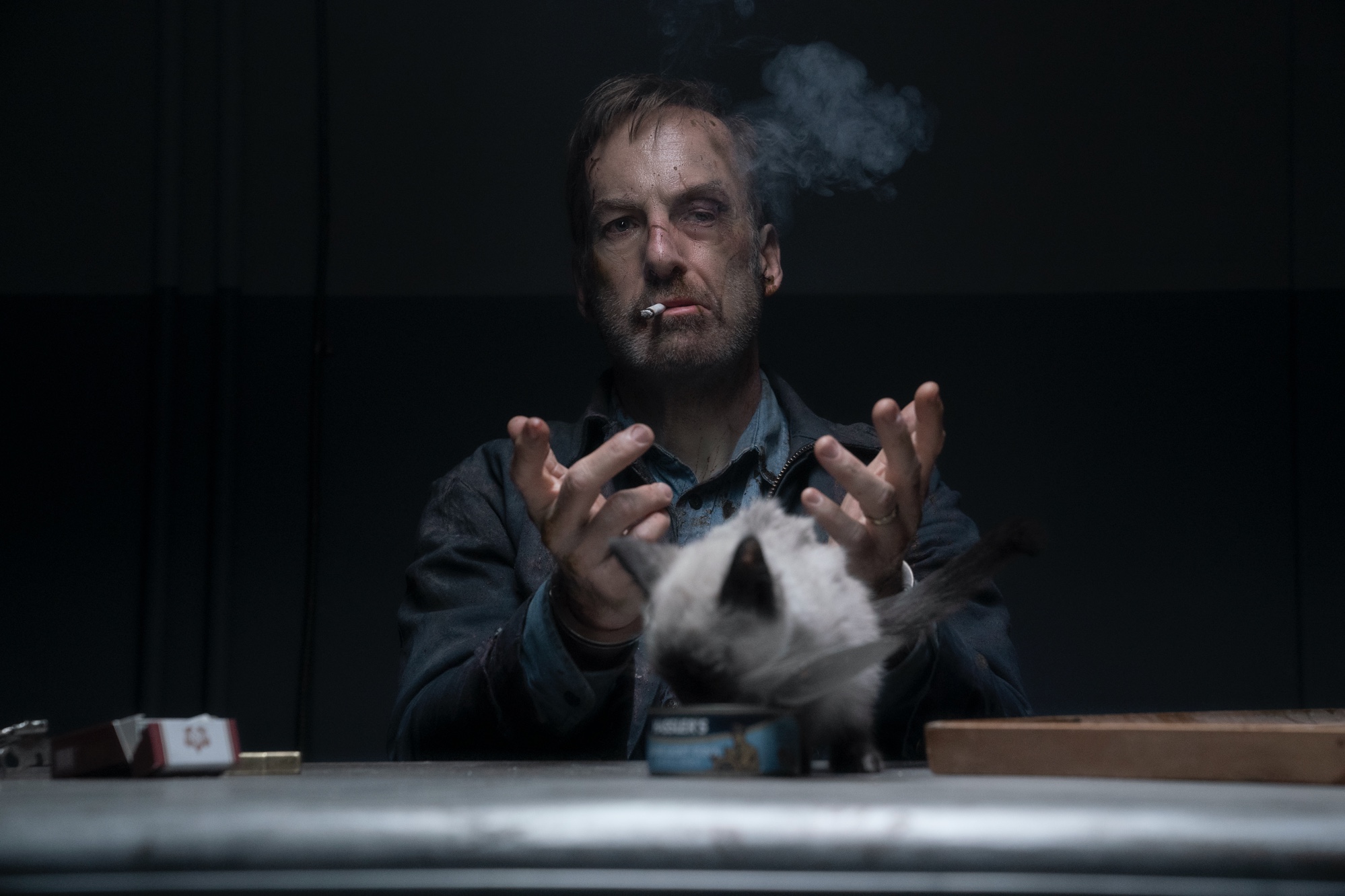 Hutch Mansell (Bob Odenkirk) in handcuffs in Nobody