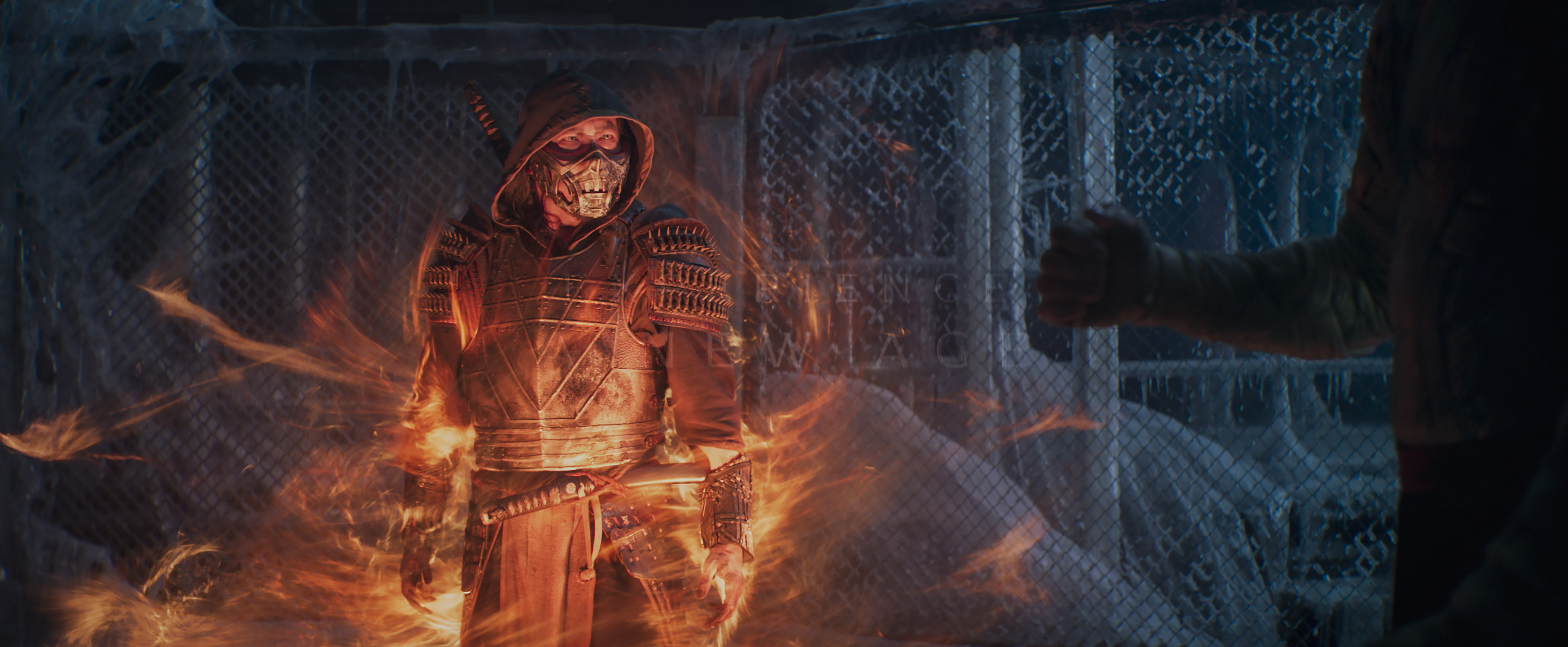 Scorpion (Hiroyuki Sanada) appears in a swirl of flame in a still from Mortal Kombat (2021)