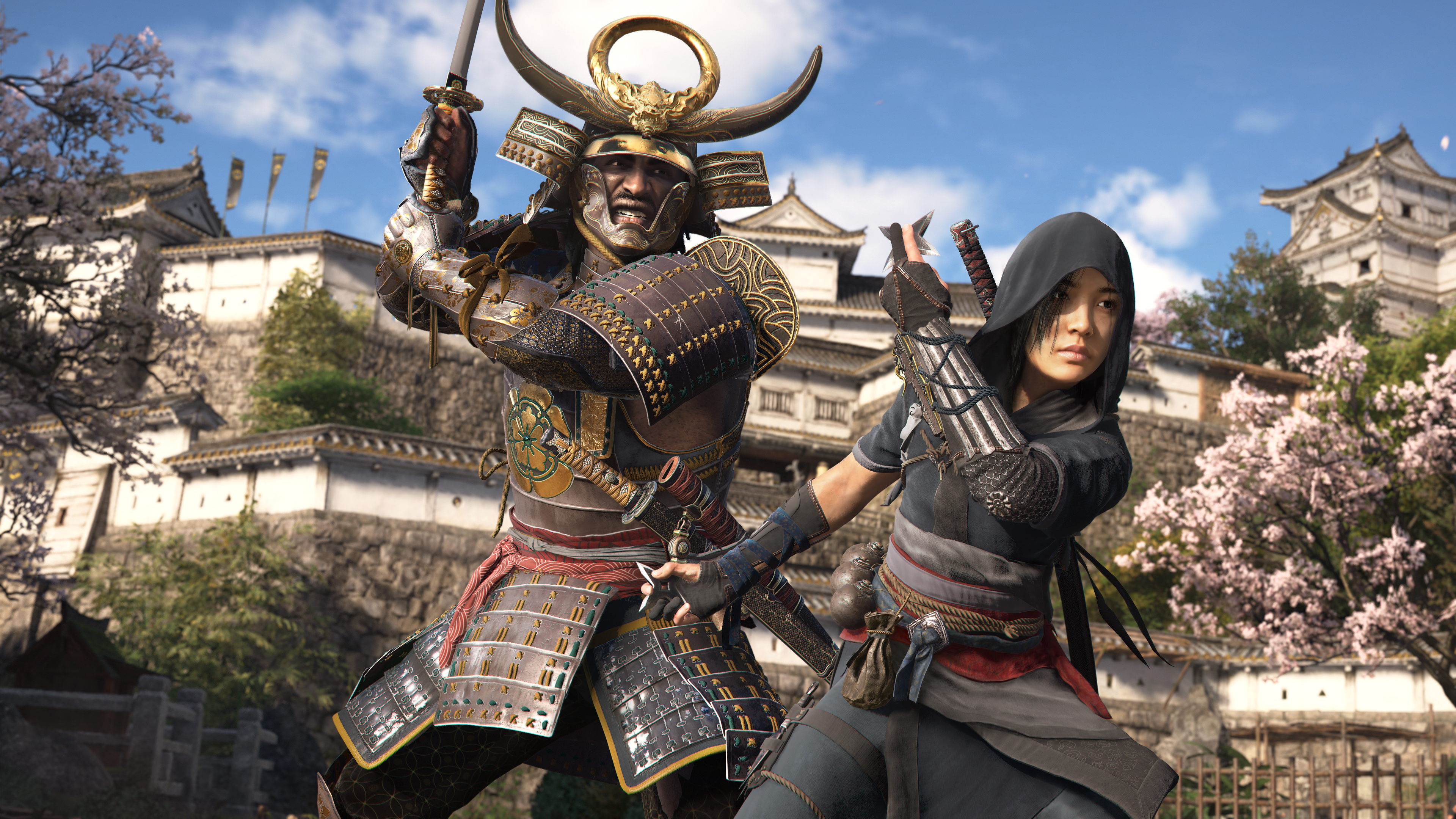 Samurai Yasuke and ninja Naoe pose in front of a Japanese castle in a screenshot from Assassin’s Creed Shadows