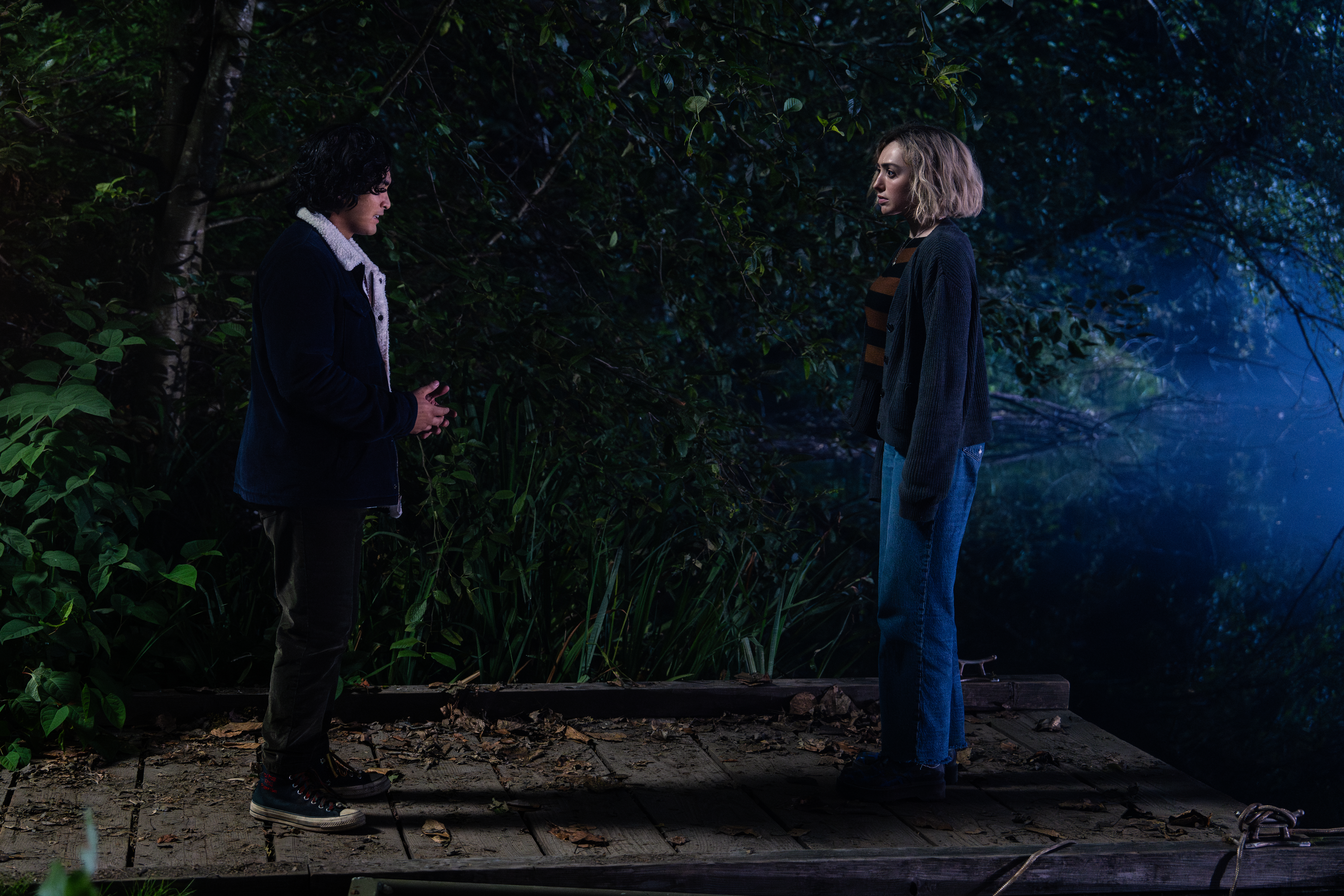 Maddie talking to Simon on a dock in a still from School Spirits