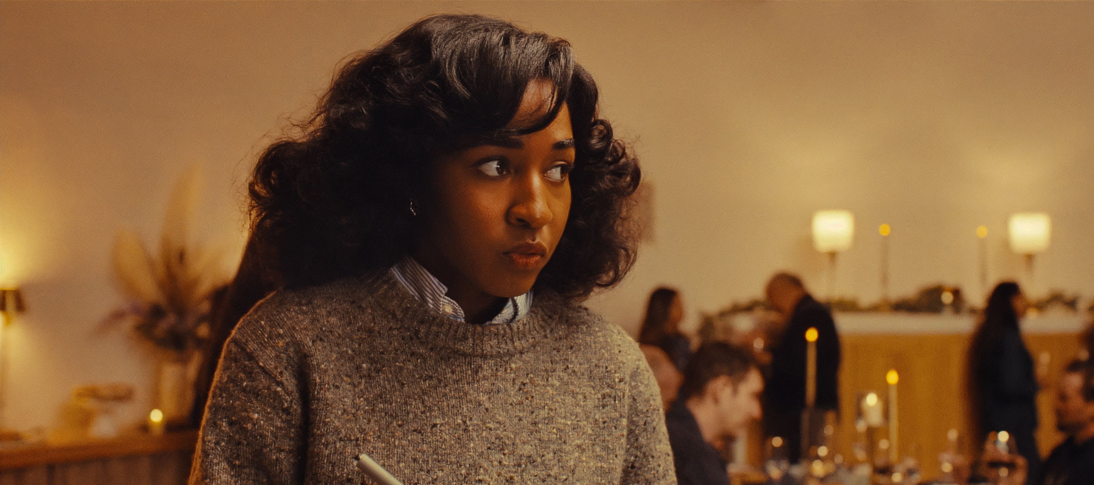 Ayo Edebiri looking worried and confused in Opus