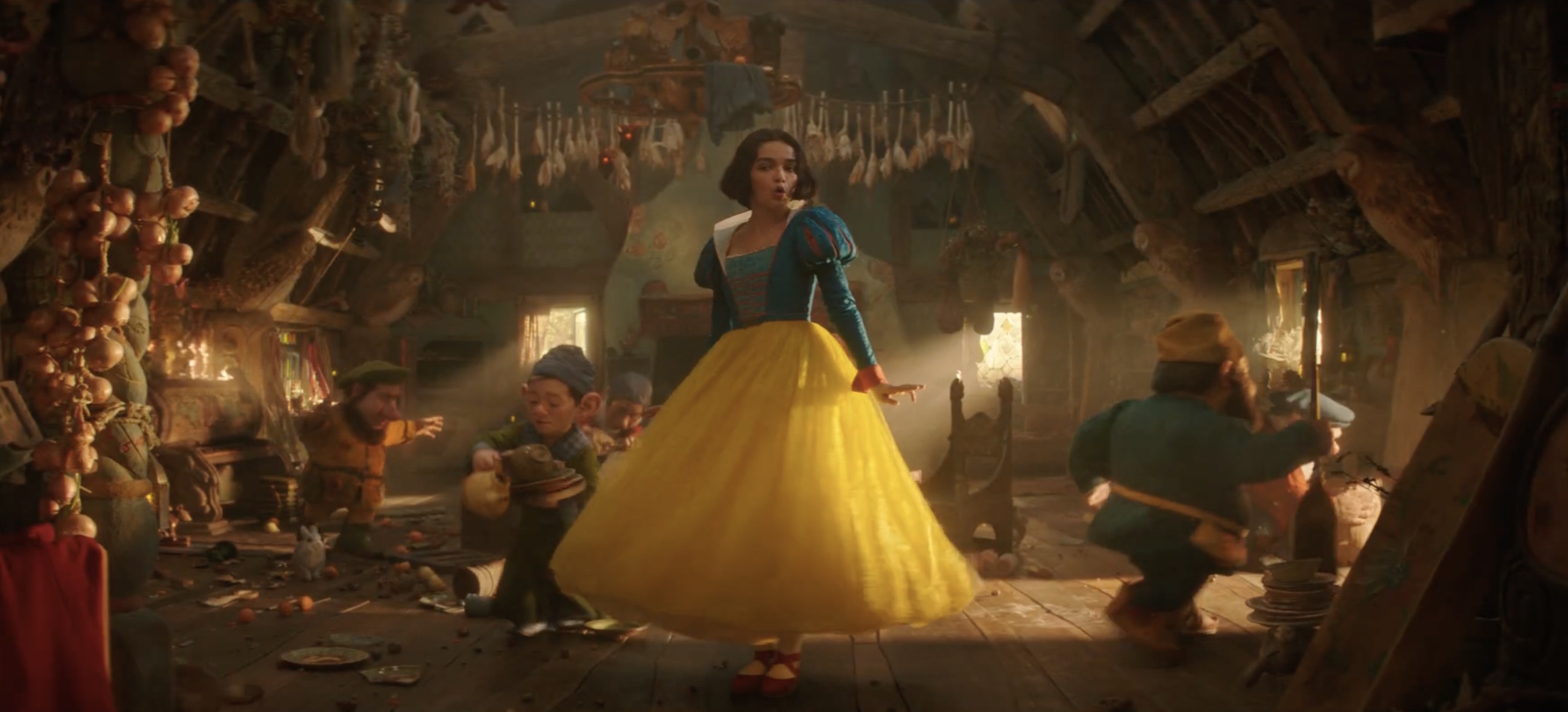 Rachel Zegler as Snow White dances with some CGI dwarves 