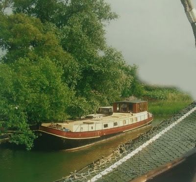 A vintage photo of a house boat