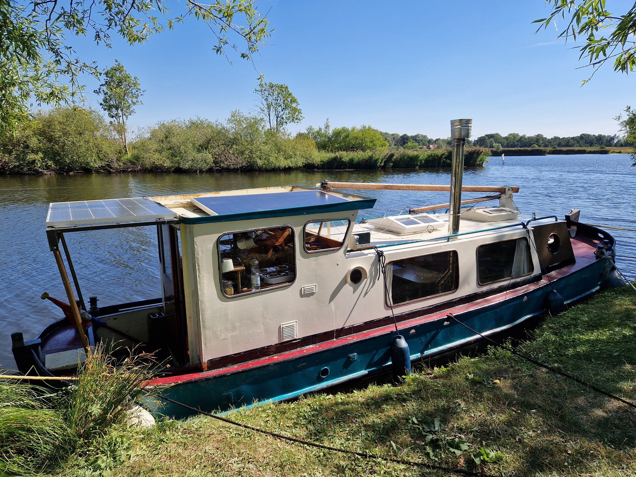A houseboat on a river.