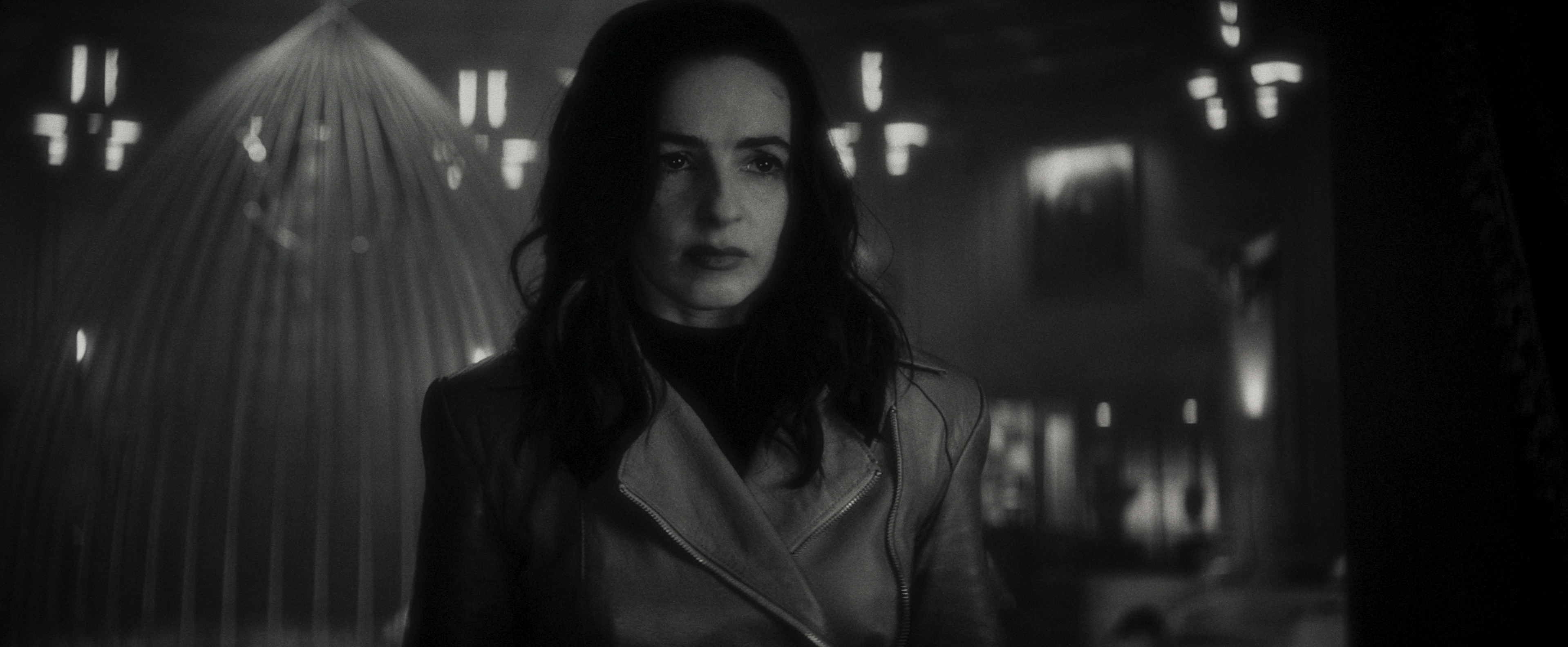Laura Donnelly looms into frame looking grim as Elsa Bloodstone in Werewolf By Night