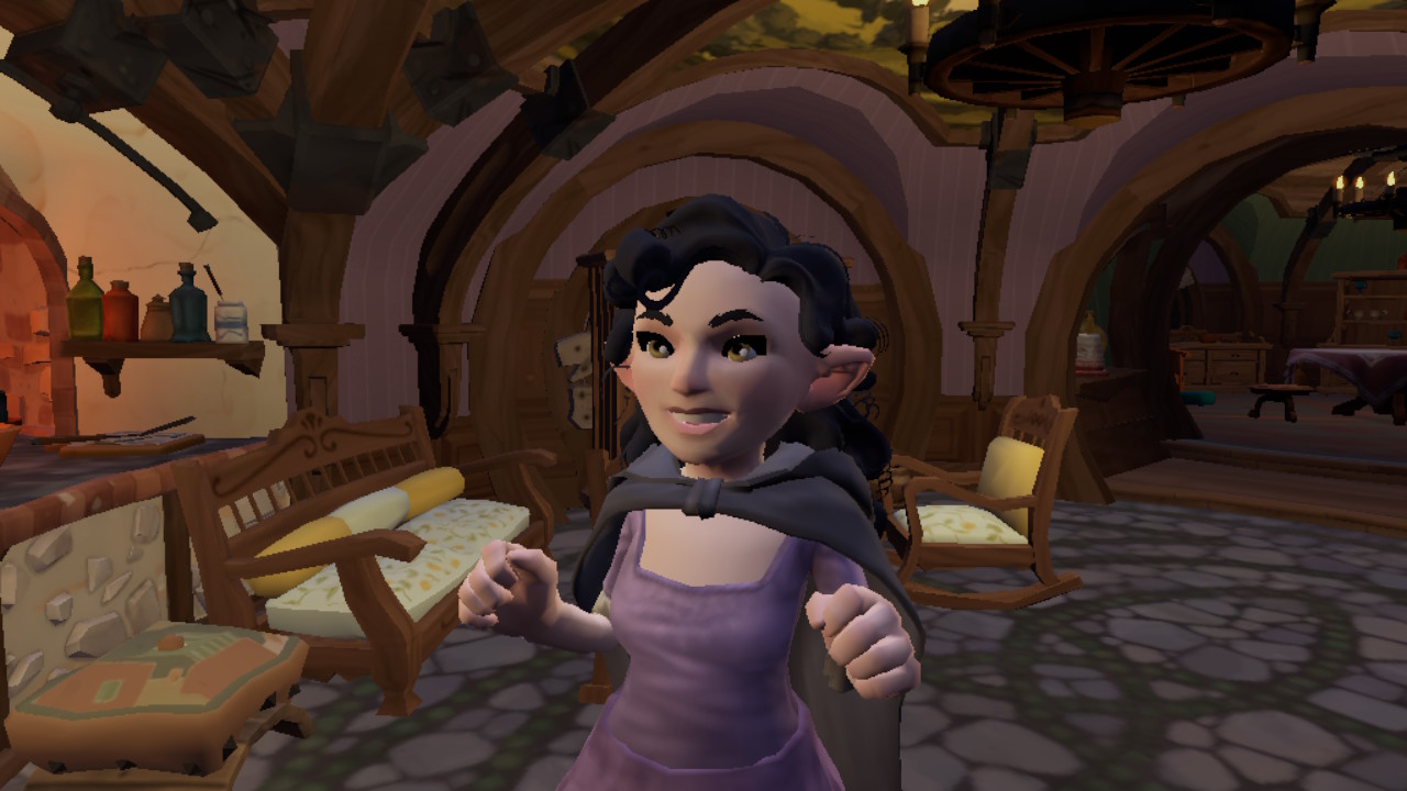 A female Hobbit from Tales of the Shire faces the camera, smiling with both hands raised. She has long black hair, pale skin, and is wearing a black cape and purple dress.