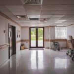 A dark and empty hospital corridor representing the setting of Fear The Timeloop