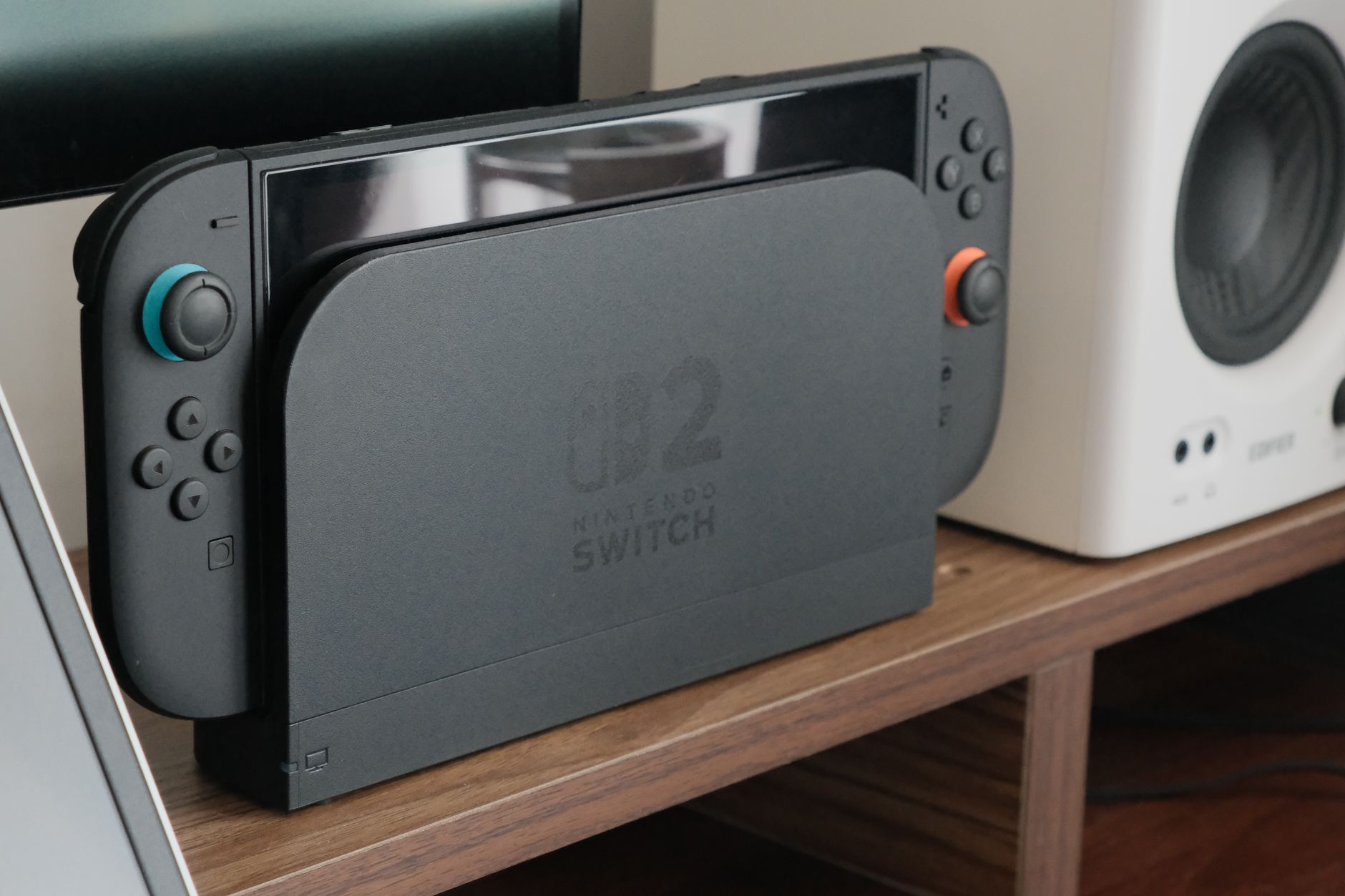 Gaming console docked and connected to a display
