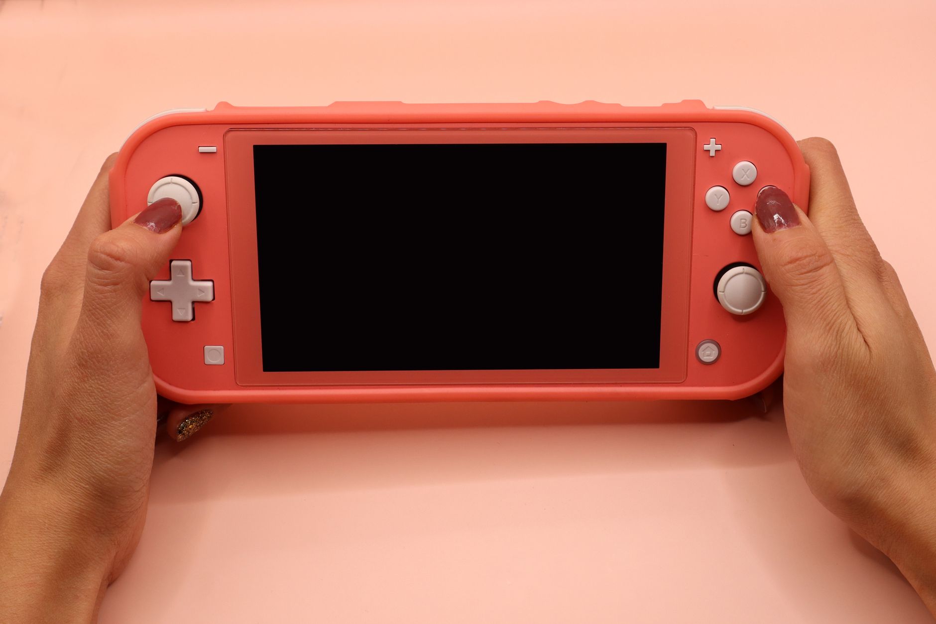Person playing Nintendo Switch representing the anniversary game releases