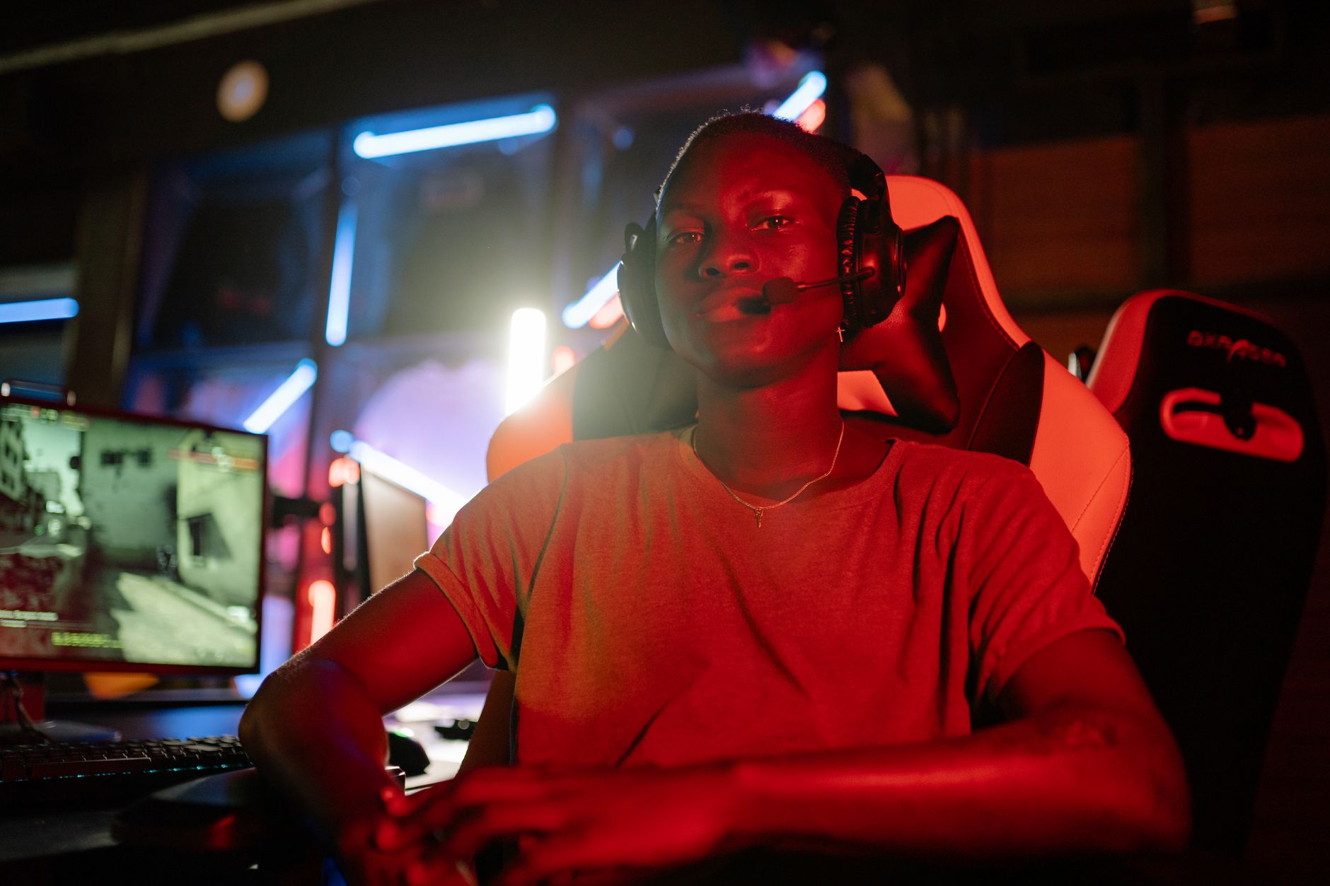 Person playing an online multiplayer game on a PC